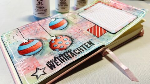 Dina Wakley Gloss Spray Hintergrund auf Mini Art Journal Seite.